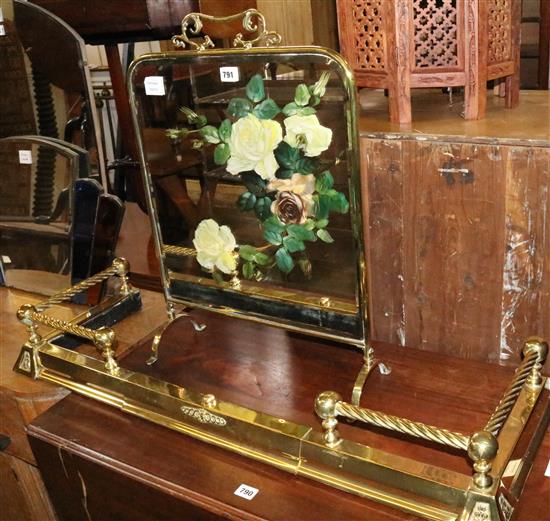 Victorian brass framed floral painted mirrored fire screen and an Edwardian brass kerb(-)